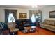 Comfortable living room with hardwood floors, sofas, and decor at 3422 Sycamore Dr, Columbus, IN 47203