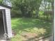 View of the backyard from the window showcasing the lush greenery at 3455 Brouse Ave, Indianapolis, IN 46218