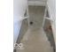 Basement stairs lead down to a blank canvas, ready for customization at 3455 Brouse Ave, Indianapolis, IN 46218