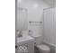 Well-lit bathroom featuring a modern vanity, toilet, and a shower-tub with curtain at 3455 Brouse Ave, Indianapolis, IN 46218