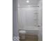 Clean bathroom with a shower and tub combination, and a white door at 3455 Brouse Ave, Indianapolis, IN 46218