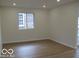 Bright room with wood-look floors featuring a window for natural light at 3455 Brouse Ave, Indianapolis, IN 46218