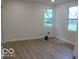 Cozy bedroom with neutral paint, hardwood floors, and natural light from the window at 3455 Brouse Ave, Indianapolis, IN 46218