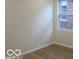 Bedroom with hardwood flooring and a window at 3455 Brouse Ave, Indianapolis, IN 46218