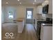 Well-lit kitchen with stainless appliances, a center island, and an open floor plan at 3455 Brouse Ave, Indianapolis, IN 46218