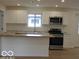 Updated kitchen featuring stainless steel appliances, stone countertops, and a center island at 3455 Brouse Ave, Indianapolis, IN 46218