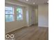 Bright living room featuring hardwood floors and natural light from double paned windows at 3455 Brouse Ave, Indianapolis, IN 46218