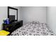 Simple bedroom with hardwood floors, neutral walls, and a comfortable bed at 3508 Brouse Ave, Indianapolis, IN 46218