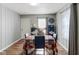 Cozy dining room with hardwood floors, neutral walls, and a dining table set for four at 3508 Brouse Ave, Indianapolis, IN 46218