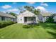 Charming single-story home with a covered front porch and well-maintained lawn at 3508 Brouse Ave, Indianapolis, IN 46218
