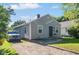 Single-story home featuring a driveway, manicured lawn, and classic architectural design at 3508 Brouse Ave, Indianapolis, IN 46218