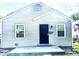 Charming home featuring horizontal siding and a black front door at 3508 Brouse Ave, Indianapolis, IN 46218