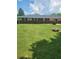 Large backyard with a spacious lawn, offering ample space for recreation and gardening at , Indianapolis, IN 46227