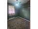 Cozy bedroom with a ceiling fan, carpet flooring, and window with natural light at , Indianapolis, IN 46227