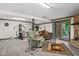 Spacious finished basement featuring a stone fireplace, an exercise area, and a cozy living space at 3813 N Ramsgate Rd, Martinsville, IN 46151