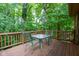 Enjoy outdoor dining on the deck, surrounded by lush greenery at 3813 N Ramsgate Rd, Martinsville, IN 46151