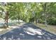 Picturesque driveway lined with mature trees forming a lush canopy, creating a serene and inviting entrance at 3813 N Ramsgate Rd, Martinsville, IN 46151