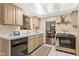 A classic kitchen with white countertops and light wood cabinets at 3813 N Ramsgate Rd, Martinsville, IN 46151