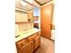 A bathroom view featuring a vanity with wooden cabinets and a medicine cabinet at 4096 N 200 W, Greenfield, IN 46140