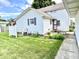 Charming home with white siding, quaint blue shutters, and a lovely outdoor space for relaxing and entertaining at 4096 N 200 W, Greenfield, IN 46140