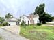 Charming two-story home with a detached garage and a well-manicured front yard with mature trees at 4096 N 200 W, Greenfield, IN 46140