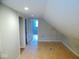 Spacious attic with a window offering natural light at 4219 Mathews Ave, Indianapolis, IN 46227