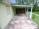 Back patio of home featuring concrete, white railings and wood privacy fencing at 4219 Mathews Ave, Indianapolis, IN 46227