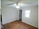 Bedroom featuring hardwood floors, a ceiling fan, and a window for natural light at 4219 Mathews Ave, Indianapolis, IN 46227