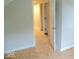 A hallway with multiple doors and a carpeted floor at 4219 Mathews Ave, Indianapolis, IN 46227
