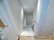 A stairway with white risers and a white handrail at 4219 Mathews Ave, Indianapolis, IN 46227