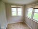 Sunroom with natural light, wood paneling and linoleum flooring at 4219 Mathews Ave, Indianapolis, IN 46227