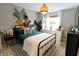 Inviting bedroom featuring a comfortable bed, stylish rug, and ample natural light at 5704 Carrousel Dr, Indianapolis, IN 46254