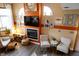 Stylish living room with fireplace, hardwood floors, accent walls and contemporary furnishings at 5704 Carrousel Dr, Indianapolis, IN 46254