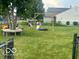 Expansive backyard featuring a playground and plenty of room for recreation and Gathering fun at 6334 Winslow Dr, Indianapolis, IN 46237