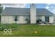 Beautiful backyard with an outdoor seating area perfect for relaxing and entertaining guests at 6334 Winslow Dr, Indianapolis, IN 46237