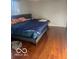 Bedroom with laminate floors and a bed with pillows at 6334 Winslow Dr, Indianapolis, IN 46237