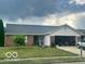 Charming brick ranch-style home featuring an attached two-car garage and well-maintained lawn at 6334 Winslow Dr, Indianapolis, IN 46237