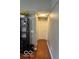 Hallway with hardwood floors, leading to the bedrooms with neutral walls and trim at 6334 Winslow Dr, Indianapolis, IN 46237