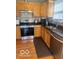 The kitchen offers stainless steel appliances, updated cabinets, granite counters and backsplash at 6334 Winslow Dr, Indianapolis, IN 46237