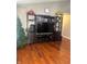 Comfortable living room with hardwood floors and a large entertainment center for storage at 6334 Winslow Dr, Indianapolis, IN 46237