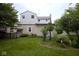 Lush backyard featuring green grass and mature landscaping at 643 Harlan St, Plainfield, IN 46168