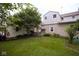 Spacious backyard with green grass and shade trees and shrubs at 643 Harlan St, Plainfield, IN 46168