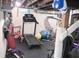 Basement gym with a treadmill, punching bag, and exercise equipment for a convenient workout space at 643 Harlan St, Plainfield, IN 46168