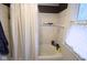 Clean bathroom featuring a shower with neutral curtains, and a blue shark figure at 643 Harlan St, Plainfield, IN 46168
