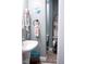 Bathroom features a pedestal sink and boat-shaped storage unit with whimsical decor at 643 Harlan St, Plainfield, IN 46168