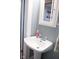 Bathroom sink with modern fixtures and a medicine cabinet with plenty of storage space at 643 Harlan St, Plainfield, IN 46168