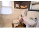 Small bathroom with a pedestal sink and an easy-to-clean toilet at 643 Harlan St, Plainfield, IN 46168