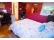 This cozy bedroom has red walls, lots of natural light, and beach-themed decor at 643 Harlan St, Plainfield, IN 46168