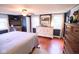This is a charming bedroom featuring hardwood floors and a ceiling fan at 643 Harlan St, Plainfield, IN 46168