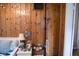 Coastal themed bedroom with wooden walls, a nightstand, and beach-inspired decor at 643 Harlan St, Plainfield, IN 46168